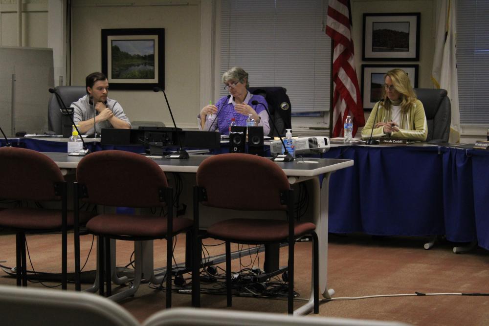 From left, Joey Still, Judith Whiteside and Sarah Corbitt discuss the Purple Heart Community designation. Photo by Brandy Muz