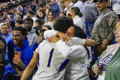 Aaron Cote celebrates with family.