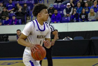 Aaron Cote makes a move toward the basket.