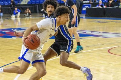 Aaron Cote evades a Royals player.