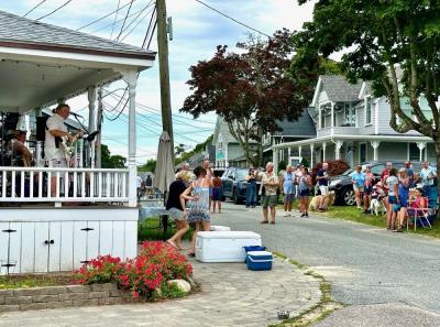 Neighbors dance to the music ringing out in the street. Source: Todd Holden