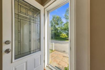 Front entry door with a decorative glass panel at the first-floor apartment, 17 Beeden Road, Westport