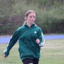 Dashing down the track, Ava Ostiguy practices sprinting.